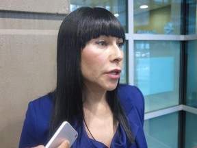 Calgary defence lawyer Tonii Roulston speaks to reporters about her client, former Canadian soldier Glen Gieschen, in Calgary on November 27, 2014.
