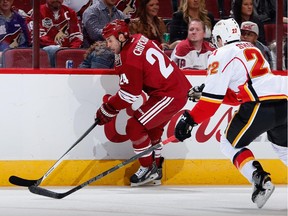 Calgary Flames forward Drew Shore eyes Arizona's Kyle Chipchura during a game last week. After being a healthy scratch on Saturday, will Shore return to the Flames lineup on Monday in L.A.?