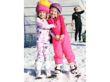 Friends Kate Ford, 5, and Kirra Pardy, 5 put on their funnest pink outfits for a day of skiing  at Canada Olympic Park as the weather on January 25, 2015 reached a spring like plus 15 Celsius.