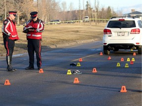 Members of the Calgary Police Traffic Unit investigate the scene of a collision involving a child at the intersection of 4 Street and Huntstrom Drive NE in Calgary on Wednesday, January 28, 2015.