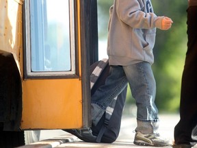 Students travel by school bus in this file photo from 2012.