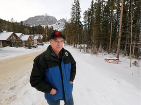 Canmore resident Steve Hrudey stands near a forested area in Peaks of Grassi that residents are fighting to maintain as an area of urban reserve after proposals were introduced to rezone it for new development.