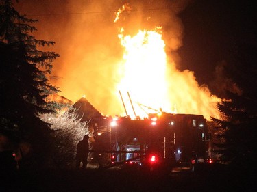 Chestermere Fire Fighters had their hands full with a fully engulfed house fire at the intersection of Highway 1 and Paradise Road on January 29, 2015.