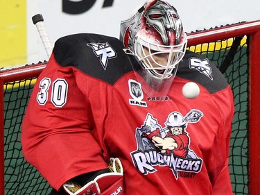 Calgary Roughnecks goalie Mike Poulin kept his eye on the a shot by the Edmonton Rush during NLL game action at the Scotiabank Saddledome on January 24, 2015.