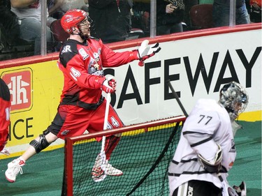 Calgary Roughnecks forward Dane Dobbie celebrated after scoring against Edmonton Rush goalie Aaron Bold during NLL game action at the Scotiabank Saddledome on January 24, 2015.