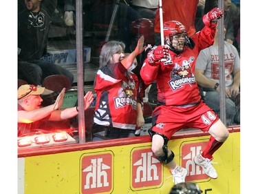 Calgary Roughnecks forward Dane Dobbie celebrated after scoring against Edmonton Rush goalie Aaron Bold during NLL game action at the Scotiabank Saddledome on January 24, 2015.