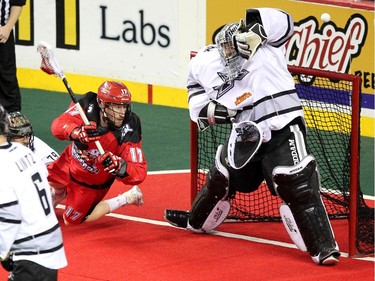 Calgary Roughnecks forward Curtis Dickson unleashed a shot on Edmonton Rush goalie Aaron Bold  as he flew into the crease area during NLL game action at the Scotiabank Saddledome on January 24, 2015.