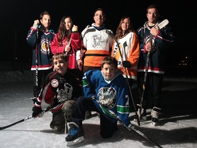 Members of the Porcellato family, front row from left, Felix (10), Ambrose (8), back from left, Samuel (15), Miriam (13), dad Peter, mom Maria and Gabriel (17) are what some would call a true hockey family with all five kids participating in minor hockey. They were photographed at the outdoor rink at the Triwood Community Centre on Tuesday.