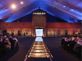 OSWIECIM, POLAND - JANUARY 27:  The original entrance gate to the former Auschwitz-Birkenau concentration camp stands encased under a tent during ceremonies marking the 70th anniversary of the liberation of Auschwitz on January 27, 2015 in Oswiecim, Poland. International heads of state, dignitaries and over 300 Auschwitz survivors are attending the commemorations for the 70th anniversary of the liberation of Auschwitz by Soviet troops on 27th January, 1945. Auschwitz was among the most notorious of the concentration camps run by the Nazis during WWII and whilst it is impossible to put an exact figure on the death toll it is alleged that over a million people lost their lives in the camp, the majority of whom were Jewish.