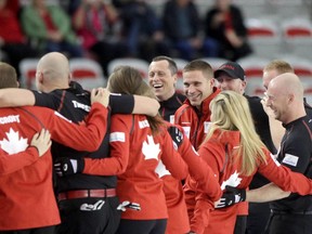 Team Canada's men and women do a cheer before starting day two of the Continental Cup at the Markin McPhail Centre at COP in Calgary on January 9, 2015.