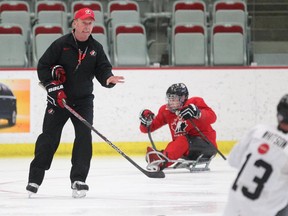 New Canadian sledge hockey coach Ken Babey works with team members during practice at the Markin MacPhail Arena on Tuesday.