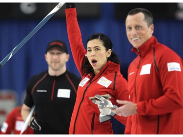 Team Canada curler Jill Officer, centre, reacted after one of her Olympic teammates made a shot against the Brad Jacobs team during an fun exhibition match between Team Jennifer Jones and Brad Jacobs to kick off the Continental Cup at the Markin MacPhail Arena at Winsport January 7, 2015.