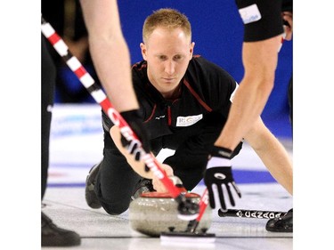 Team Canada skip Brad Jacobs delivered his rock into the hands of his sweepers during his game against Team Europe's Niklas Edin during the opening round of team action in the Continental Cup at the Markin MacPhail Arena at Winsport January 8, 2015.