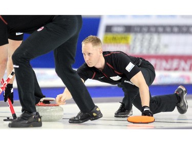 Team Canada curler Brad Jacobs let go of his shot during his game against Team Europe's Niklas Edin during the opening round of team action in the Continental Cup at the Markin MacPhail Arena at Winsport January 8, 2015.