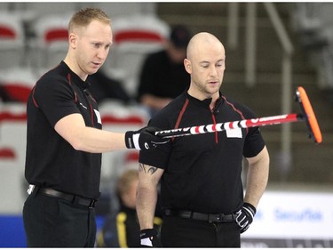 Team Canada curler Brad Jacobs, left, gave instructions to third Ryan Fry during his game against Team Europe's Niklas Edin during the opening round of team action in the Continental Cup at the Markin MacPhail Arena at Winsport January 8, 2015.