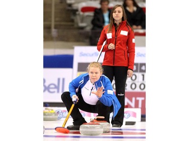 Team Europe skip Margaretha Sigfriddsson signalled to her sweepers as Team Canada's Rachel Homan watched from the back of the house during the opening round of team action in the Continental Cup at the Markin MacPhail Arena at Winsport January 8, 2015.