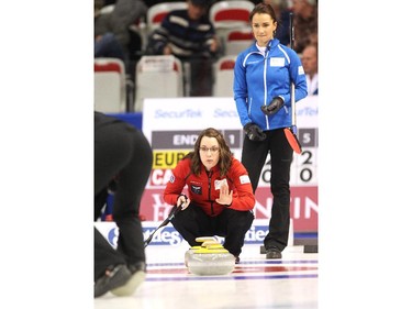 Team Canada skip Val Sweeting, foreground, called to her sweepers during her game against Team Europe's Anna Sidorova, right, during the opening round of team action in the Continental Cup at the Markin MacPhail Arena at Winsport January 8, 2015.