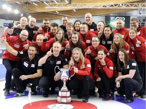 Team Canada celebrates with the Continental Cup at the Markin McPhail Centre in Calgary on Sunday.