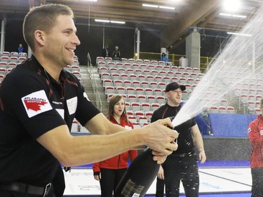 Canada's John Morris celebrates with champagne after Team Canada won the Continental Cup at the Markin McPhail centre in Calgary on Sunday January 11, 2015.