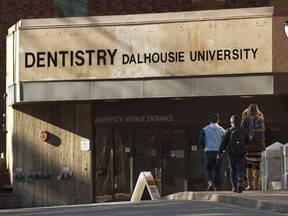 Students head to the Dalhousie University dentistry building. There are renewed calls for the expulsion of 13 male dentistry students at the school after they allegedly posted misogynistic comments about their female colleagues on Facebook.