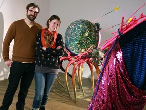 Dave Foy and Jenn Saliek, the art team of DaveandJenn, with their sculpture The Binding Line, at TrepanierBaer Gallery in Calgary, January 2015. It's part of their show This Sinking Feeling Could Keep You Afloat.