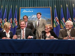 Mayors Naheed Nenshi and Edmonton's Don Iveson joined from left, Municipal Affairs Minister Diana McQueen, Premier Jim Prentice, AUMA President Helen Rice and AAMDC President Al Kenmore. 
The group signed a framework and timeline for a new municipal agreement at McDougall Centre in Calgary on Thursday.