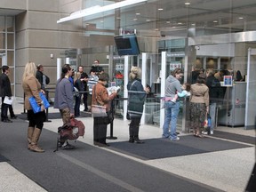 People line up to get inside the Calgary Court house.