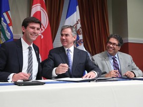 Edmonton Mayor Don Iveson, left, with Premier Jim Prentice and Calgary Mayor Naheed Nenshi  in October 2014.