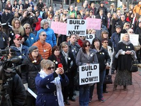 Hundreds of Calgarians rally to fight against proposed delays to the Calgary Cancer Centre, at the McDougall Centre on January 28, 2015.