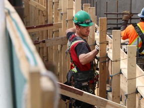 Construction workers work on the foundations in the old King Eddy Hotel site an area which will become part of the National Music Centre.