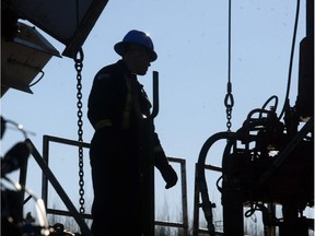 A oilfield worker toils on a Bonterra rig near the town of Drayton valley on a few  years ago.