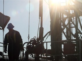 An oil worker  toils on a rig near Drayton Valley.