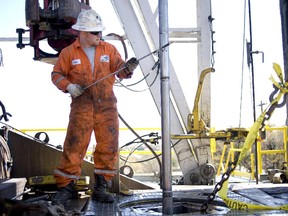 A Baker Hughes worker conducts a wireline survey on a Chesapeake Energy natural gas rig.