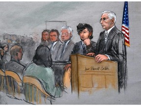 In this courtroom sketch, Boston Marathon bombing suspect Dzhokhar Tsarnaev, second from right, is depicted with his lawyers, left, beside U.S. District Judge George O'Toole Jr., right, as O'Toole addresses a pool of potential jurors in a jury assembly room at the federal courthouse, Monday, Jan. 5, 2015, in Boston.