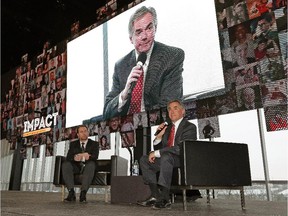 Premier Jim Prentice (right) and Edmonton Economic Development Corp. president and CEO Brad Ferguson speak at the Economic Development Edmonton Impact Luncheon on Tuesday.