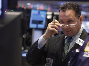 Trader Edward Curran works on the floor of the New York Stock Exchange Monday, Jan. 5, 2015. US stocks opened lower Monday, led by declines in energy stocks as the price of oil plunged again.