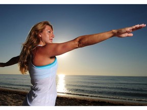 Yoga on the beach, anyone? The trick to sticking to your healthy ways during a holiday is try doing at least a bit of exercise every day or two.