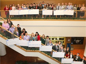 Representatives of the 2014 Calgary Herald Christmas Fund recipient agencies gather with Herald staff after receiving their donations Wednesday January 28, 2015.