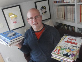 Bart Beaty holds a stack of his Archie comics, among the thousand he read to research his book on the enduring series 12 Cent Archie.