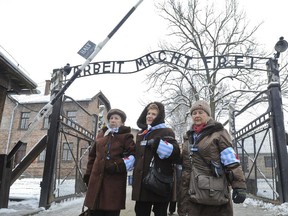 Holocaust survivors walk outside the gate of the of the Auschwitz Nazi death camp Tuesday. Reader notes resurgence of anti-Semitism in the world.