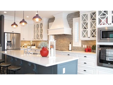 A luxurious kitchen in Huxley II by Cedarglen Homes in Riverstone of Cranston.