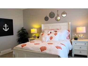 The master bedroom in the Huxley II by Cedarglen Homes in Riverstone of Cranston.