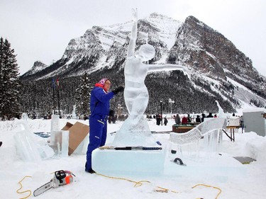 Sculptor Edith Van de Wetering  works in details on Aurora, her personification of the Northern Lights, on Day Two of the Ice Magic Festival on the shore of Lake Louise Saturday January 17, 2015. She was on Team Double Dutch Trouble from the Netherlands. Her sculpture was part of the International Ice Carving Competition in which 10 internationally accredited teams of 2 are given 15 blocks of ice and 34 hours to create a frozen masterpiece using the theme Wonders of the World.