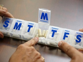 Local Input~ People getting ready to take their pills  // UNDATED -- senior citizen pills medication pharmaceuticals pharmacy drugs prescription 
CREDIT: FOTOLIA
(FOR NATIONAL POST USE ONLY)/pws