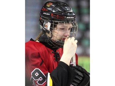 Calgary Fire forward Audrey Buston showed her emotions after being awarded the silver medal following the teams loss to the Saskatoon Stars in the Max's AAA Midget Tournament female final at the Scotiabank Saddledome on January 1, 2015. The Stars defeated the Fire 4-2 to claim the cup.