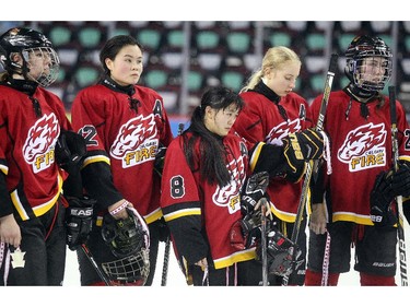 Members of the Calgary Fire watched as their opponent the Saskatoon Stars were awarded the gold medal following the Max's AAA Midget Tournament female final at the Scotiabank Saddledome on January 1, 2015. The Stars defeated the Fire 4-2 to claim the cup.