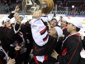Cariboo Cougars wining goalie Griffen Outhouse hoisted the trophy with his teammates after they defeated the Regina Pat Canadians in the Max's AAA Midget Tournament male final 2-1 in double overtime at the Scotiabank Saddledome on January 1, 2015.