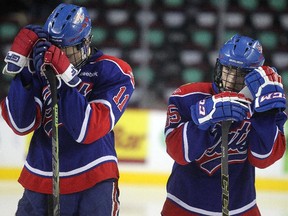 Regina Pat Canadians defencemen Riley Mohr, left, and Jake Tesarowski stood dejected on their blue line after losing the Max's AAA Midget Tournament male final 2-1 in double overtime at the Scotiabank Saddledome on January 1, 2015.