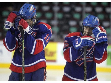 Regina Pat Canadians defencemen Riley Mohr, left, and Jake Tesarowski stood dejected on their blue line after losing the Max's AAA Midget Tournament male final 2-1 in double overtime at the Scotiabank Saddledome on January 1, 2015.