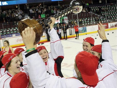 Saskatoon Stars forward Danielle Nogier hoisted the cup while surrounded by her teammates following the Max's AAA Midget Tournament female final at the Scotiabank Saddledome on January 1, 2015. The Stars defeated the Calgary Fire 4-2 to claim the cup.